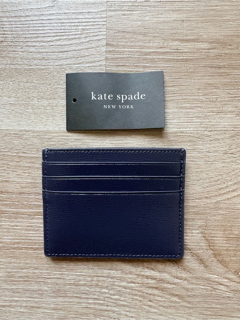Kate Spade navy card holder with red floral applique and orange polka dots - Picture 3 of 5